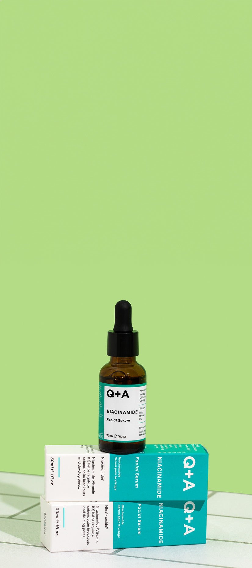 Q+A Niacinamide Facial Serum on tiles